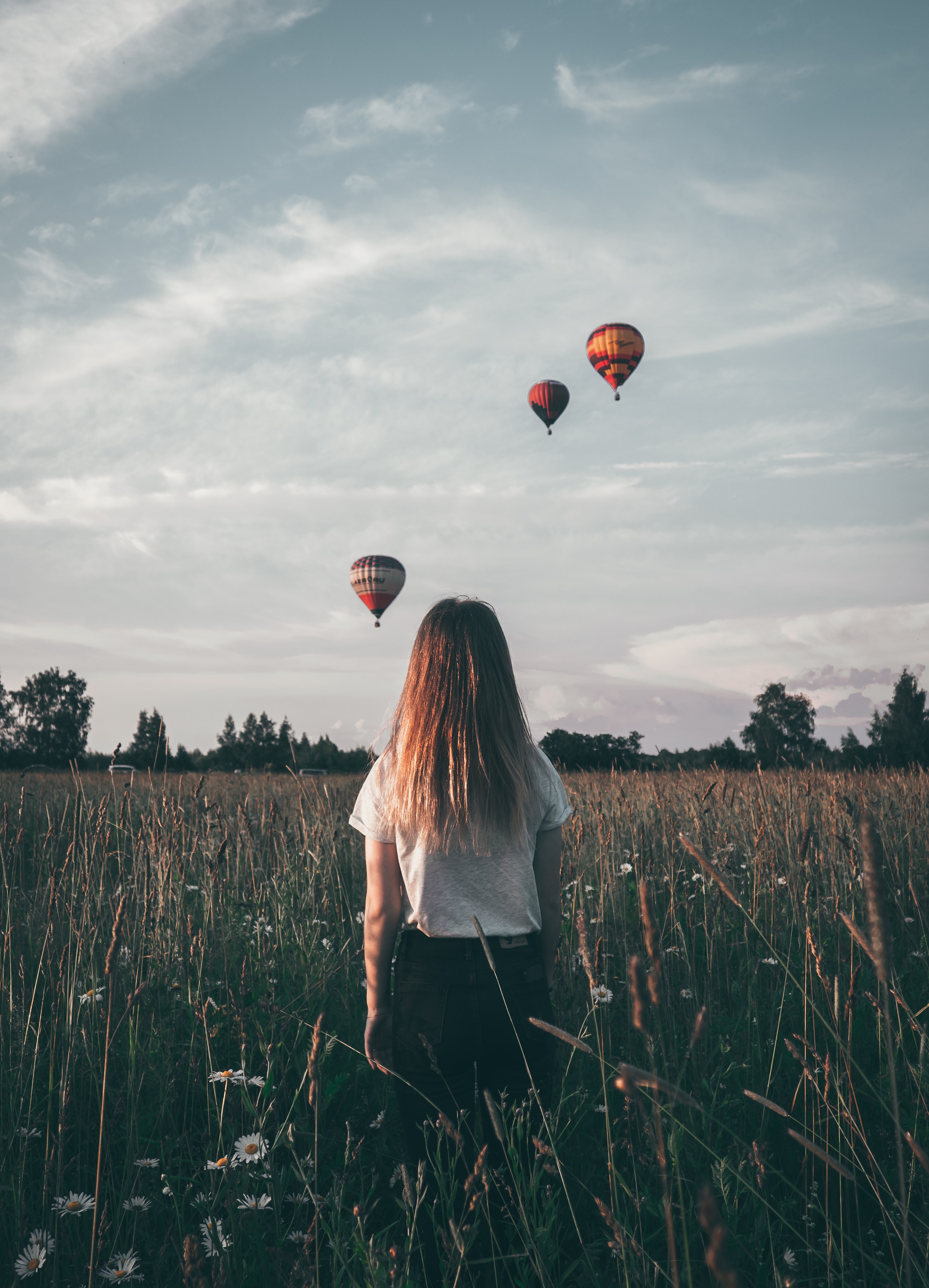 Image of girl looking at ballons